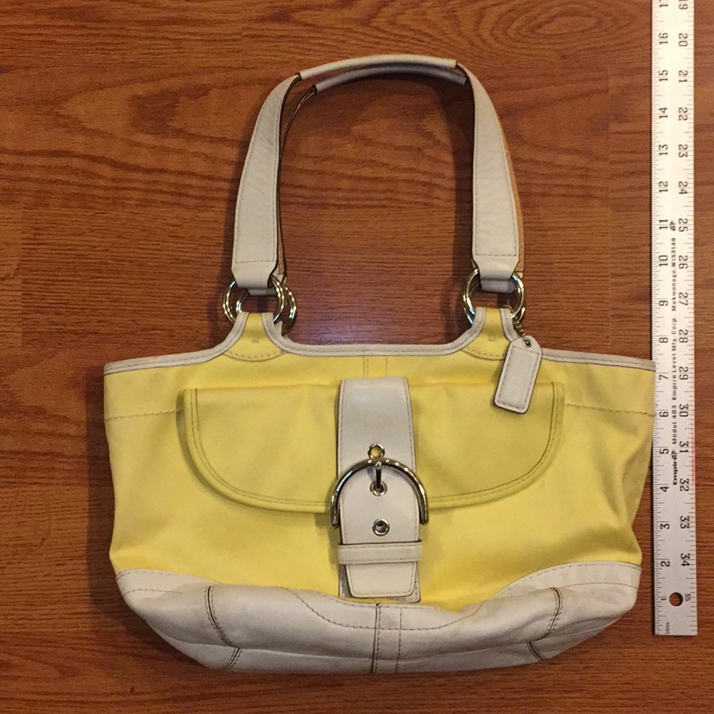Yellow and white/cream Coach handbag